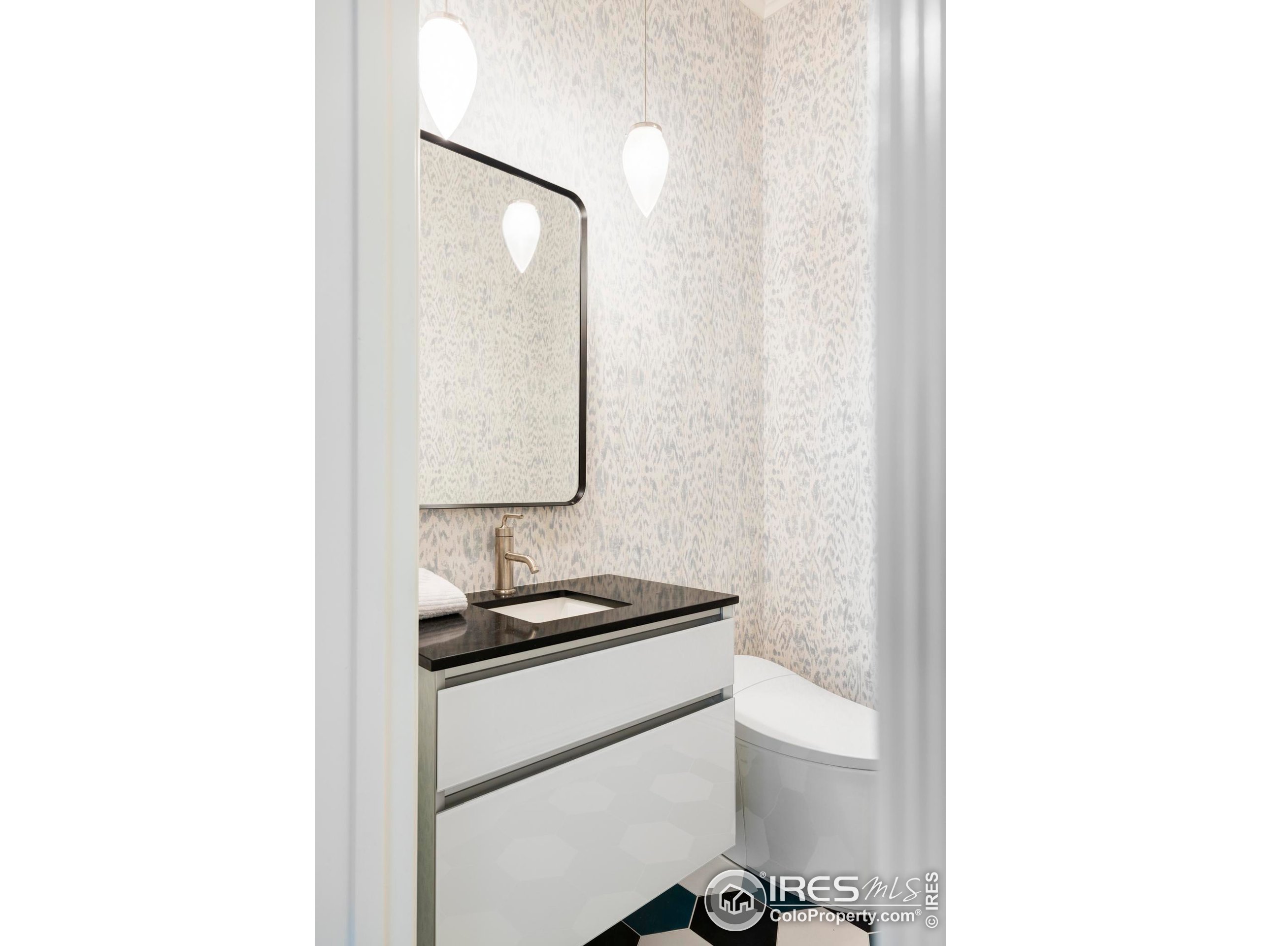 3189 5th Street Boulder, CO 80304 - Photo 11 of 37 a bathroom with a sink and a mirror