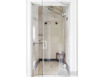 a bathroom with a shower and a toilet