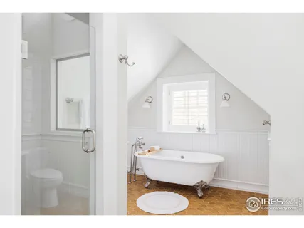 a bathroom with a sink mirror toilet and shower