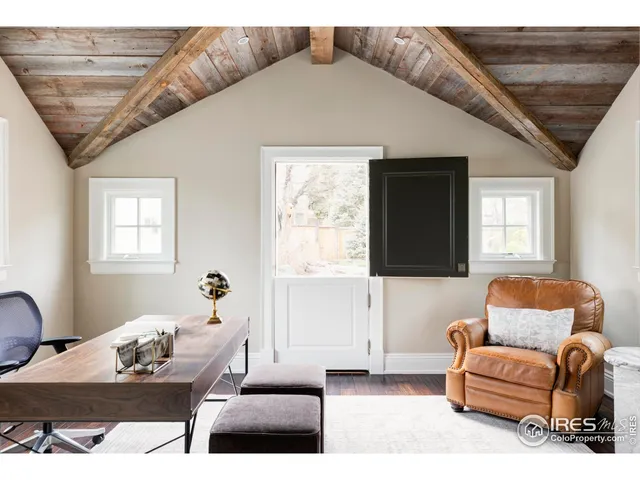 a workspace with furniture and window