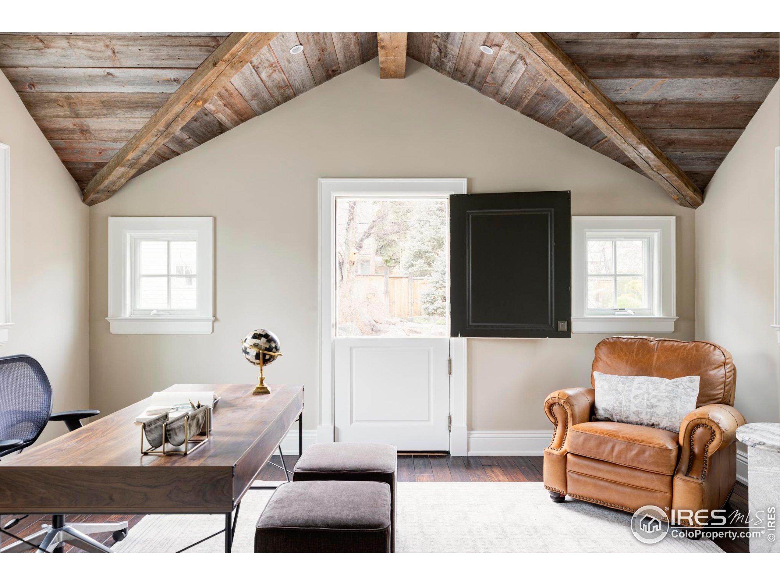 3189 5th Street Boulder, CO 80304 - Photo 28 of 37 a living room with furniture a ceiling fan and a window