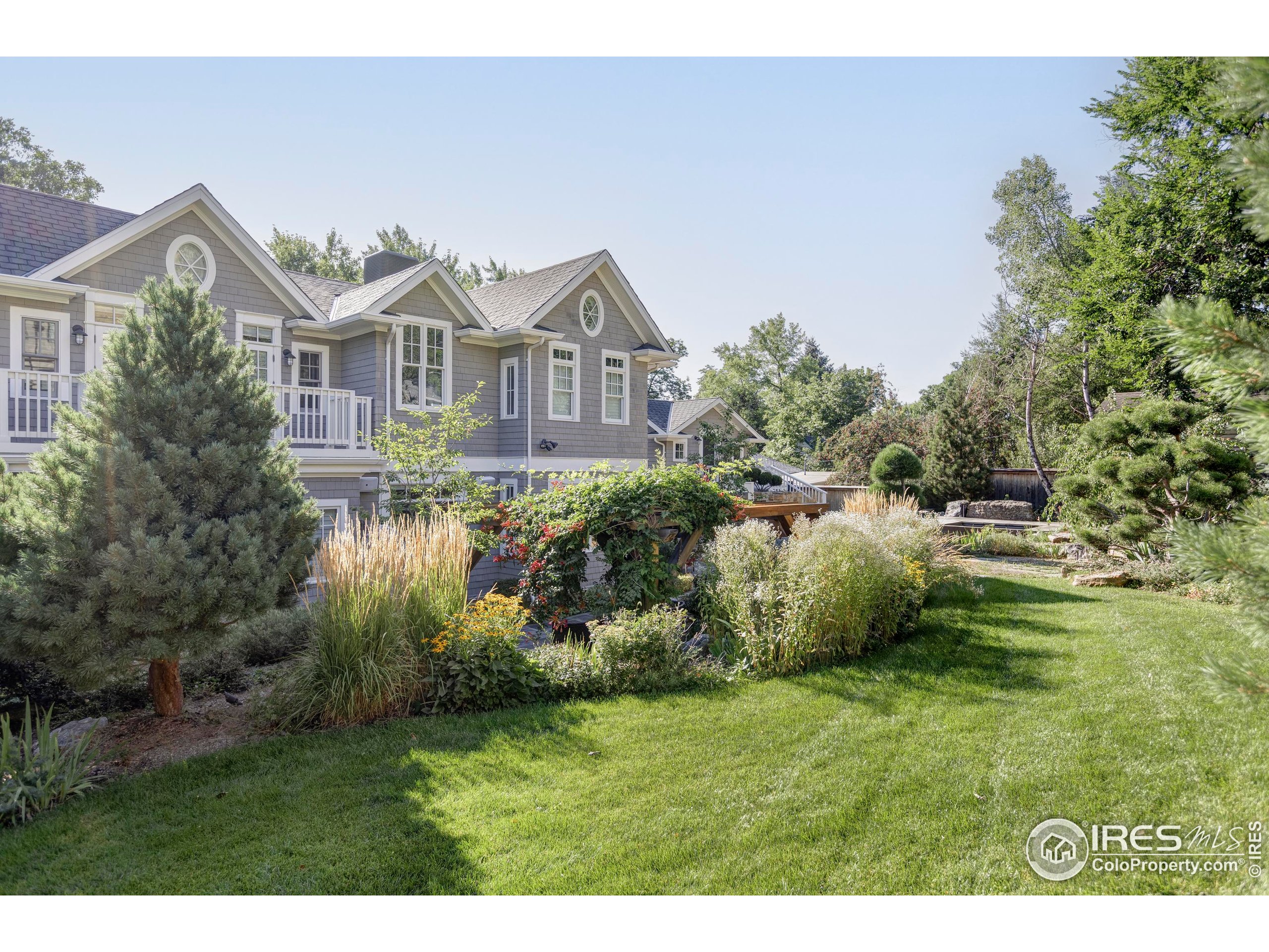 3189 5th Street Boulder, CO 80304 - Photo 32 of 37 a front view of a house with a yard