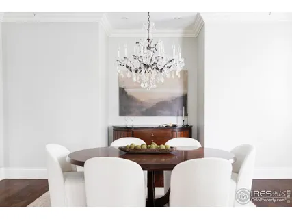 a dining room with furniture and chandelier
