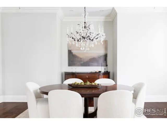 a dining room with furniture and chandelier