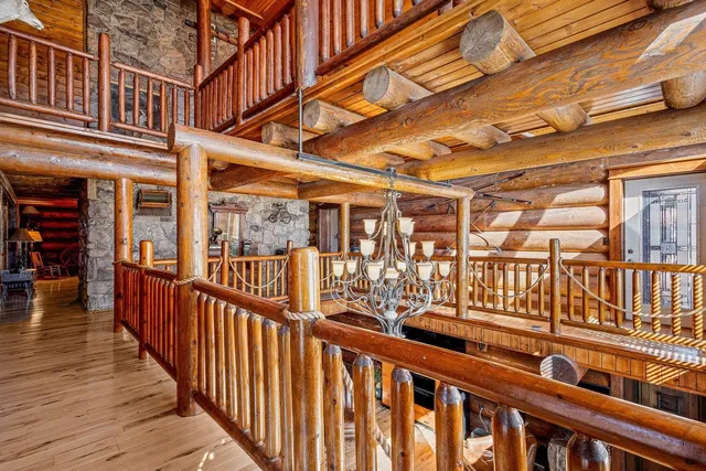 a view of roof deck with wooden fence and floor