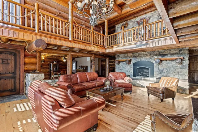 a view of a dining room with furniture and chandelier