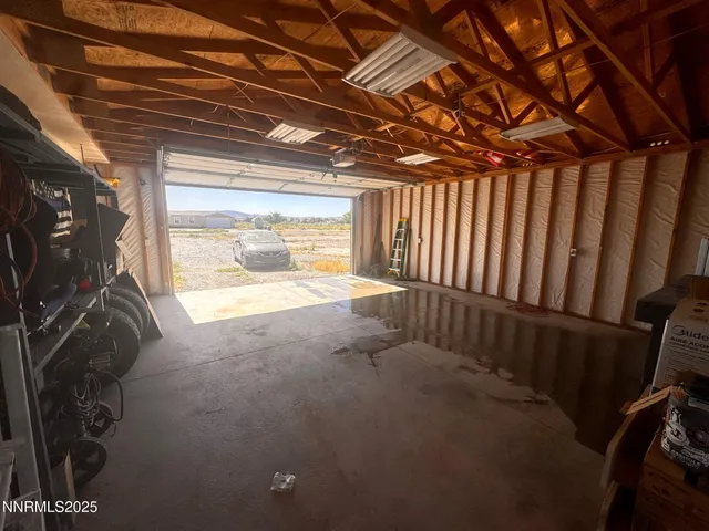 a view of an empty room with a fireplace