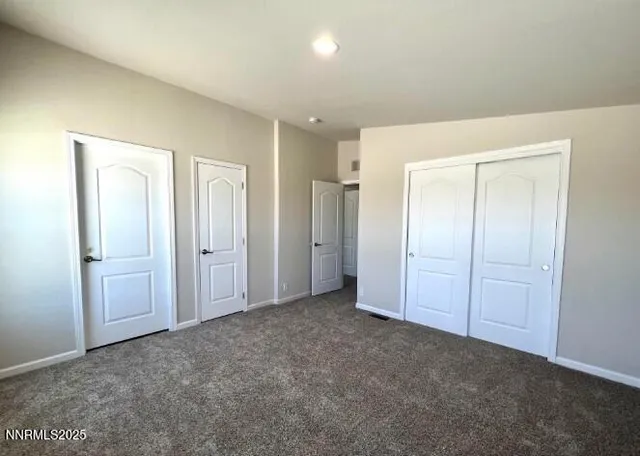 an empty room with closet area