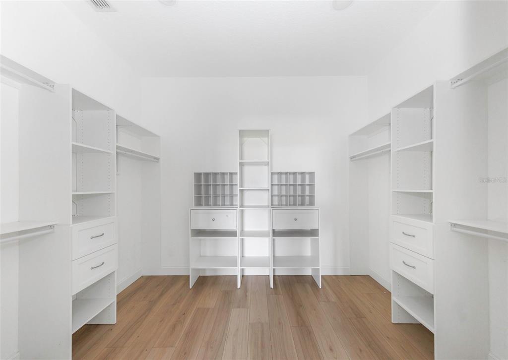 20138 Bowman Road Spring Hill, FL 34610 - Photo 24 of 40 a view of a room with closet and racks on the wall