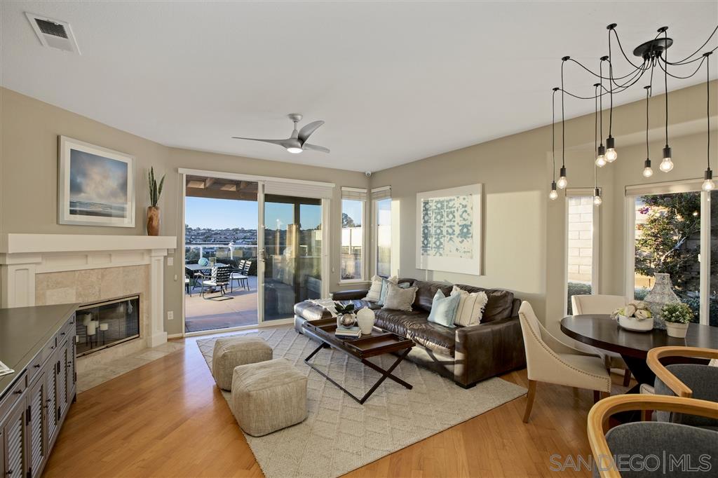 5466 Soledad Road La Jolla, CA 92037 - Photo 14 of 18 a living room with furniture a fireplace and a chandelier