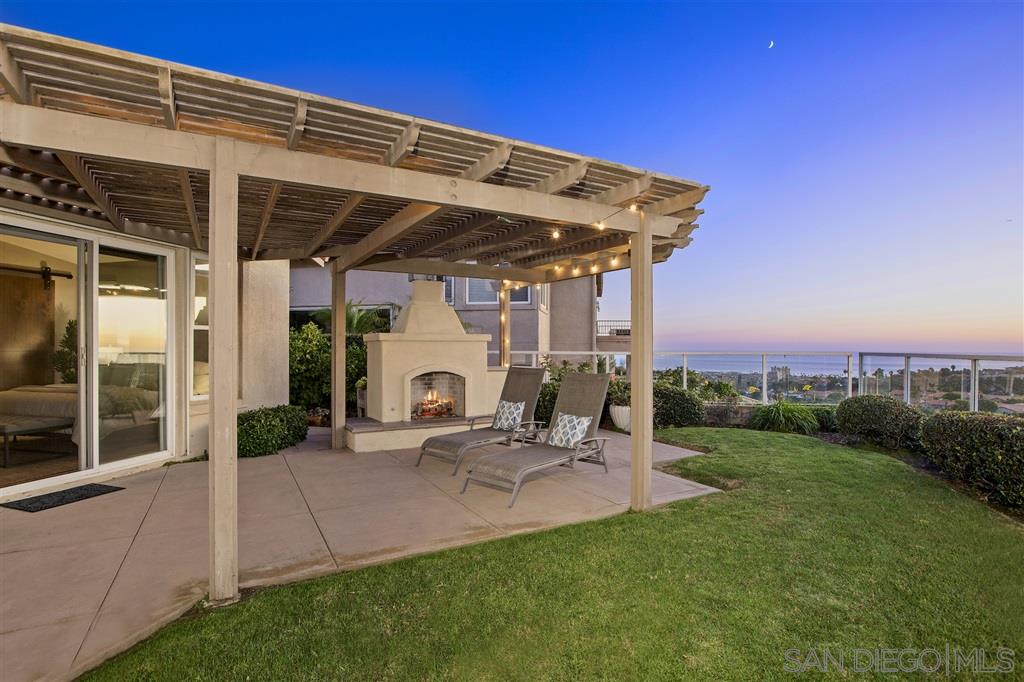 5466 Soledad Road La Jolla, CA 92037 - Photo 3 of 18 a view of a chair and table in backyard of the house