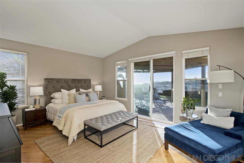 5466 Soledad Road La Jolla, CA 92037 - Photo 7 of 18 a bedroom with a bed and a large window with outer view