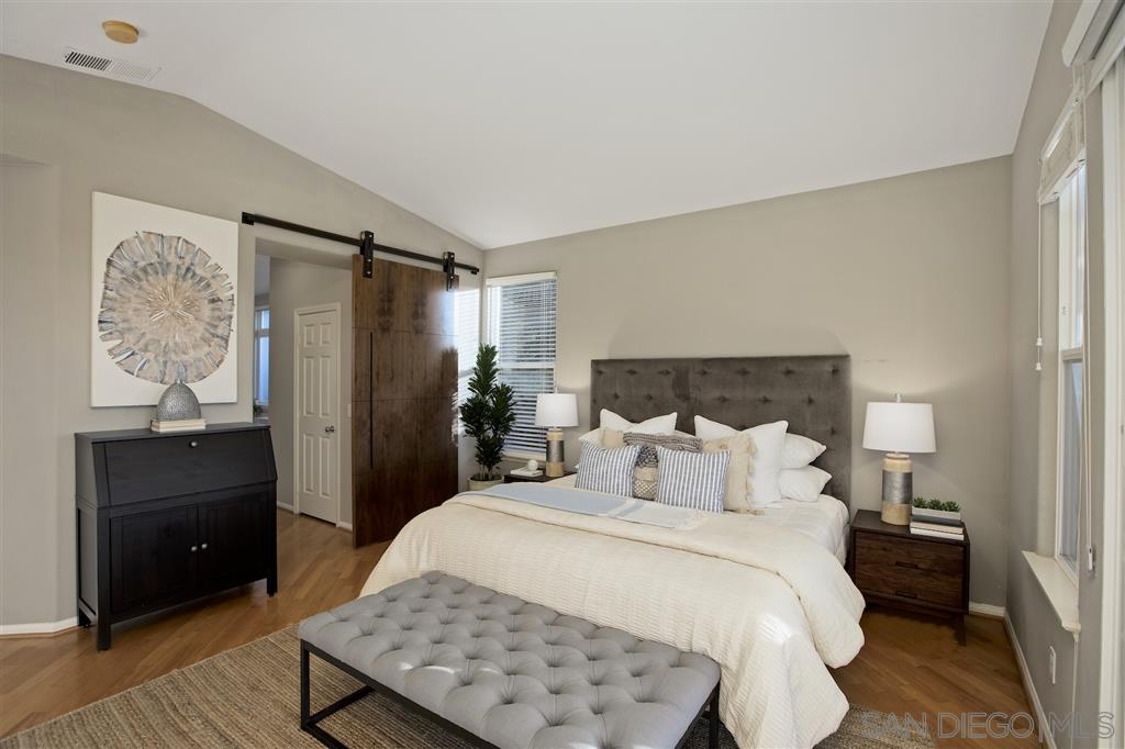 5466 Soledad Road La Jolla, CA 92037 - Photo 8 of 18 a bedroom with a bed and a dresser