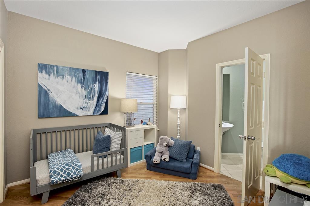 5466 Soledad Road La Jolla, CA 92037 - Photo 10 of 18 a bedroom with furniture and a window