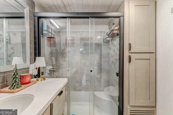a kitchen with stainless steel appliances a sink and cabinets