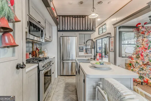 a bed room with a bed and a chair