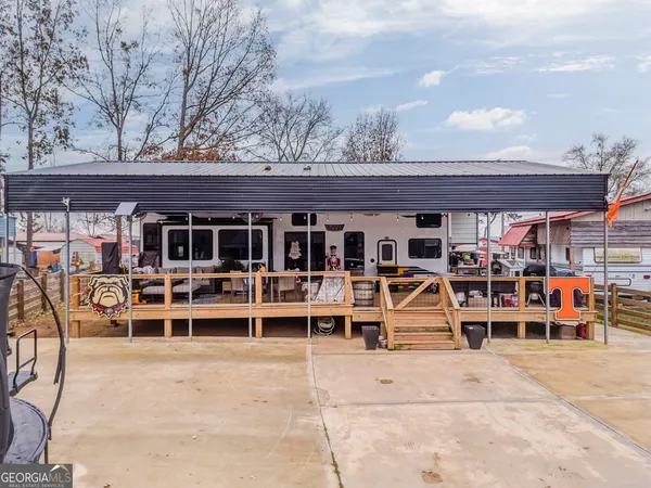 front view of a house with a large window and wooden floor