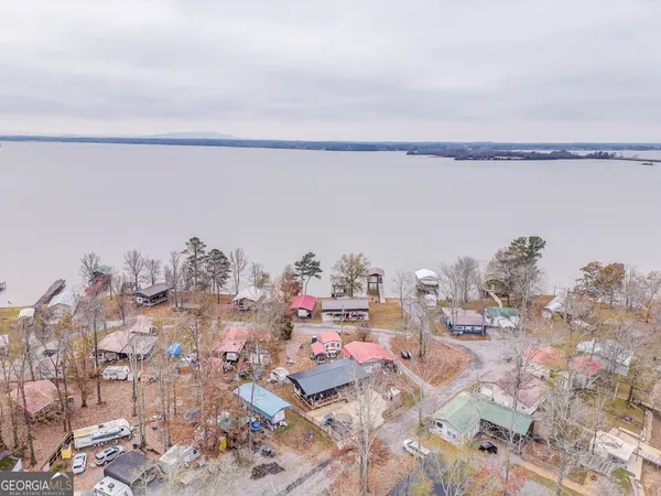 a bedroom with a large bed and a large window