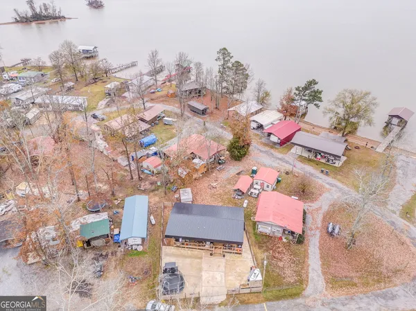 a bathroom with a sink vanity granite shower and a mirror