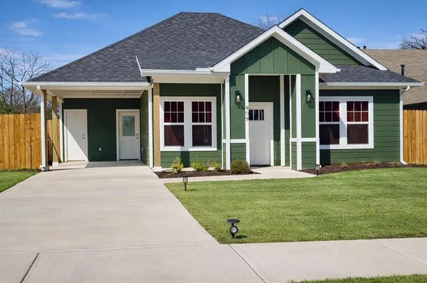 front view of a house with a yard