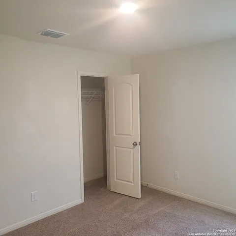 a view of a room that has a window in it