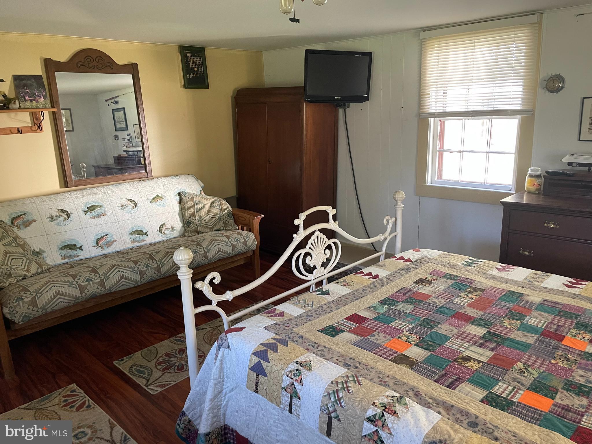 2720 Church Street Quantico, MD 21856 - Photo 13 of 35 a bedroom with a bed and wooden floor