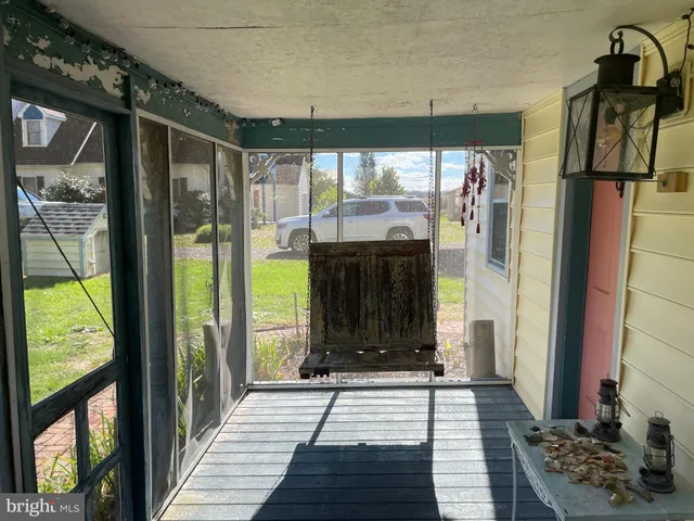 a view of a entryway door front of a house
