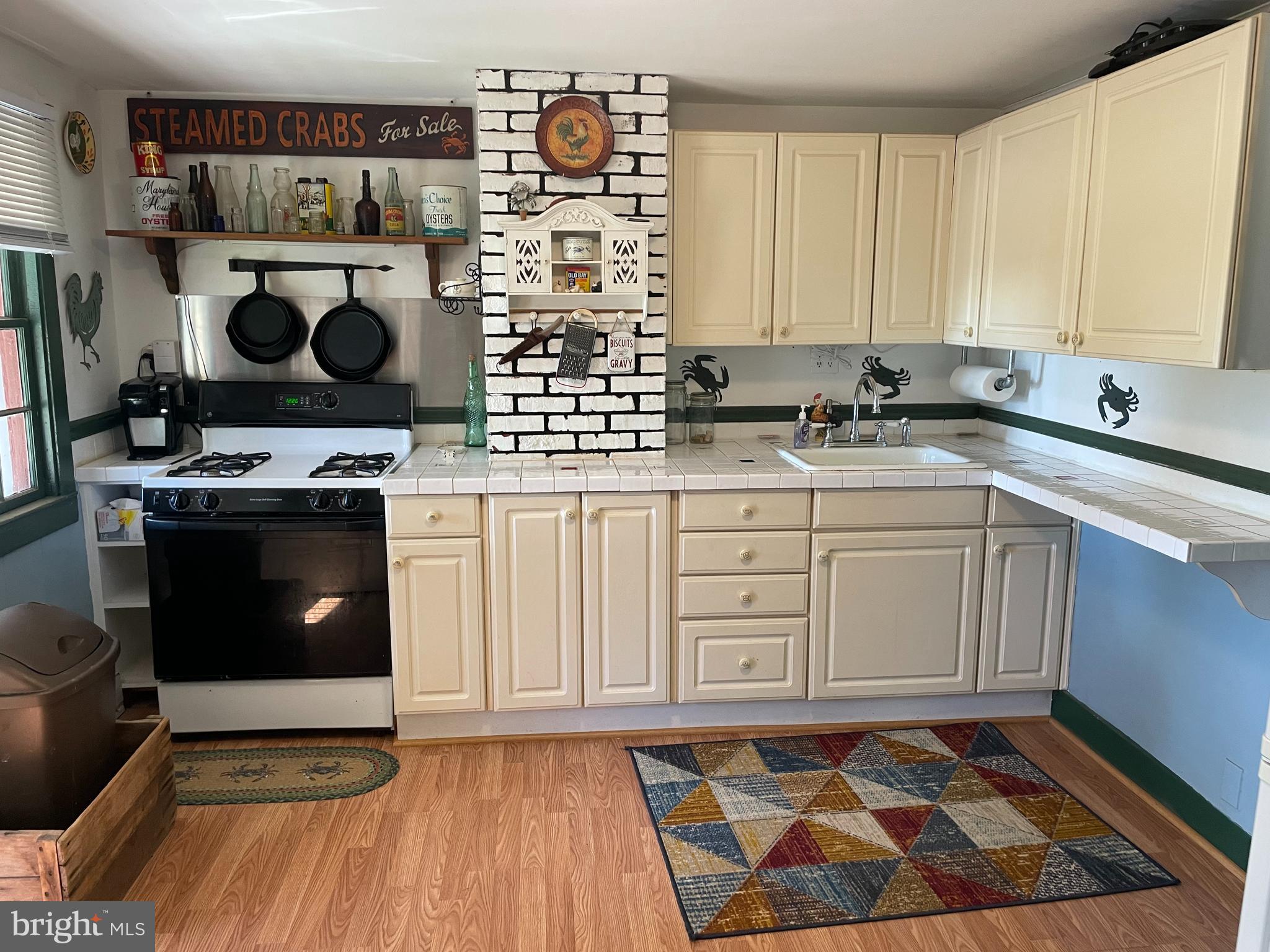 2720 Church Street Quantico, MD 21856 - Photo 7 of 35 a kitchen with stainless steel appliances a stove and white cabinets
