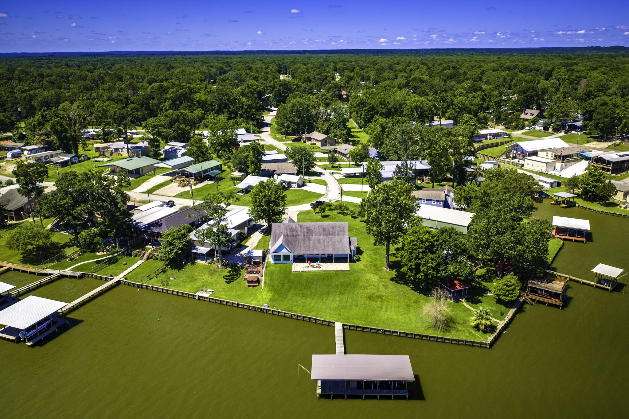 151 Key Largo Loop Point Blank, TX 77364 - Photo 41 of 49 Rare waterfront point lot offering expansive shoreline, breathtaking views, and private dock in a peaceful lakeside setting.