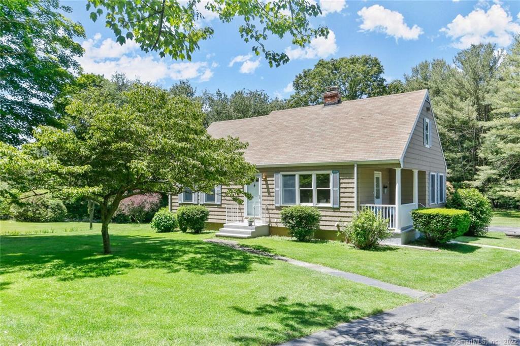 76 Beers Road Easton, CT 06612 - Photo 1 of 1 a front view of house with yard and green space
