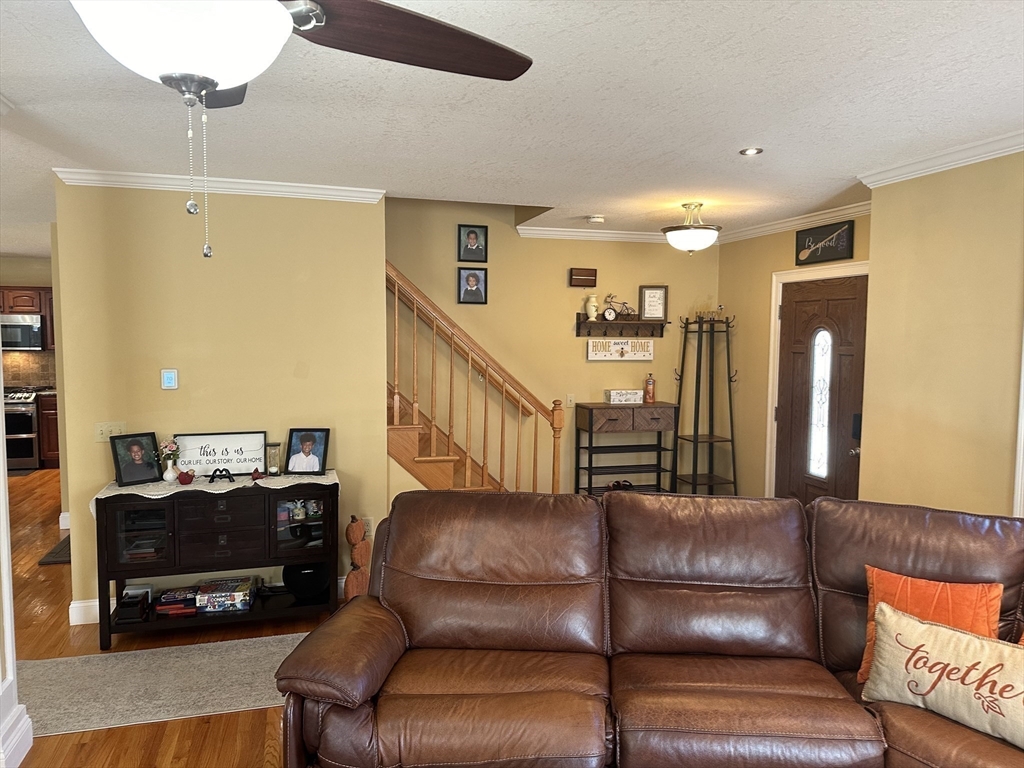 329 Forest Hills Road Springfield, MA 01128 - Photo 18 of 42 a living room with furniture and a wooden floor
