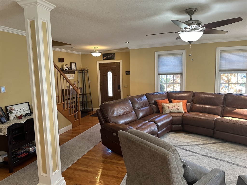 329 Forest Hills Road Springfield, MA 01128 - Photo 19 of 42 a living room with furniture and a chandelier
