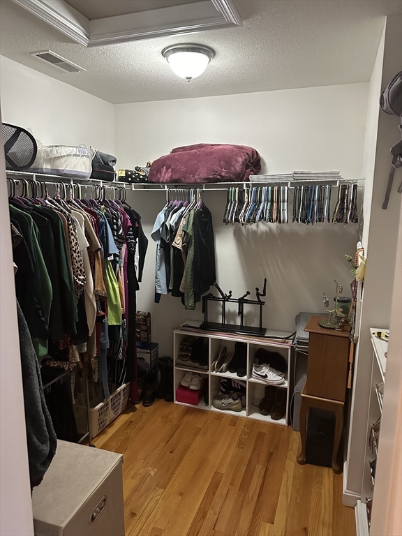 329 Forest Hills Road Springfield, MA 01128 - Photo 28 of 42 a view of walk in closet with clothes and shoes