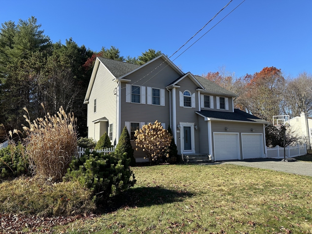 329 Forest Hills Road Springfield, MA 01128 - Photo 3 of 42 a front view of a house with a yard