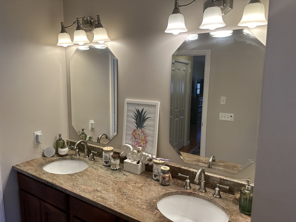 329 Forest Hills Road Springfield, MA 01128 - Photo 31 of 42 a bathroom with double vanity sinks and a mirror