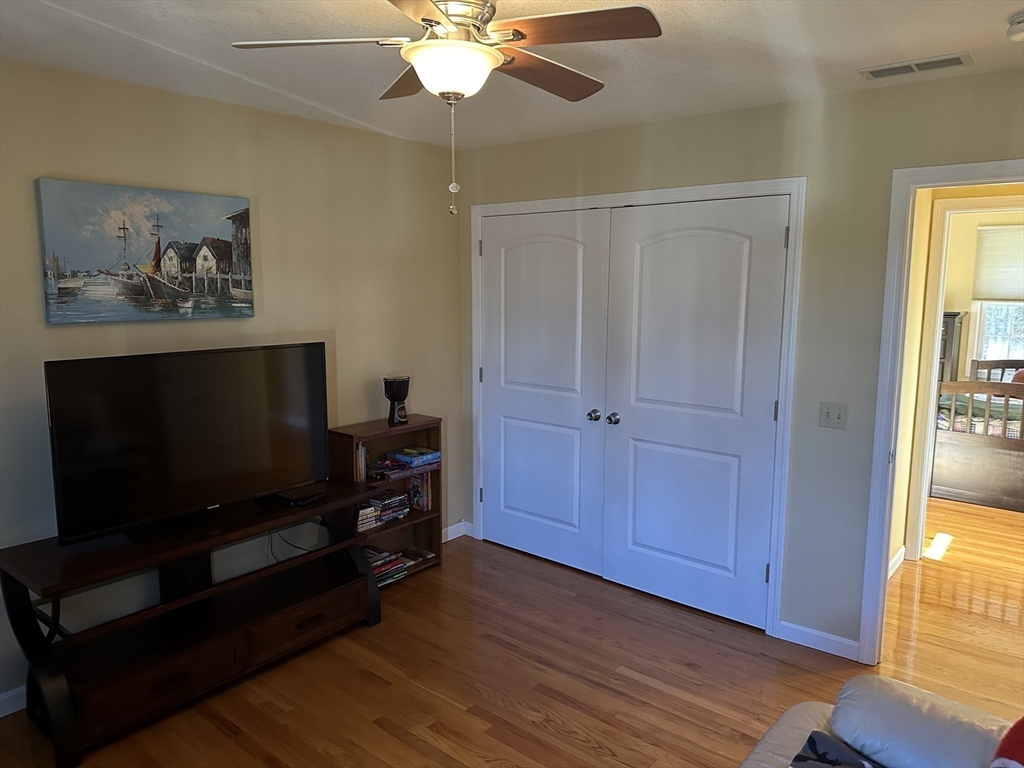 329 Forest Hills Road Springfield, MA 01128 - Photo 35 of 42 a living room with furniture and a flat screen tv