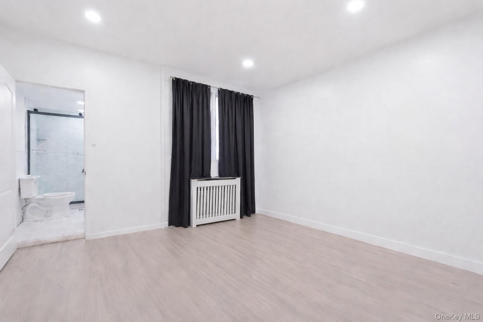 60-89 54th Street Queens, NY 11378 - Photo 9 of 22 1st Floor Master bedroom with a bathroom