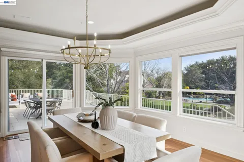a living room with furniture and a lamp