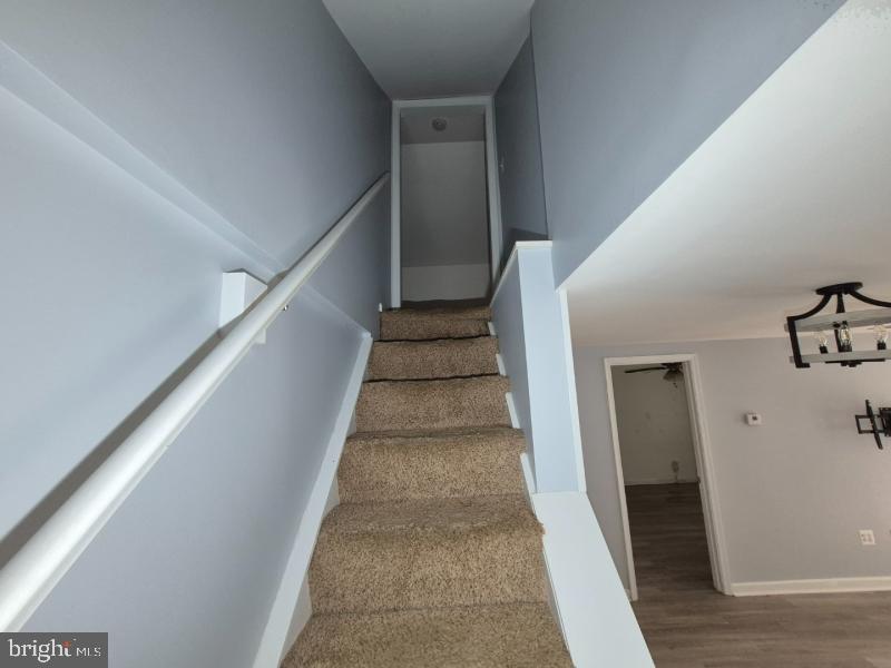 215 Sycamore Road Glen Burnie, MD 21060 - Photo 9 of 16 Inviting ascent to upper living space.