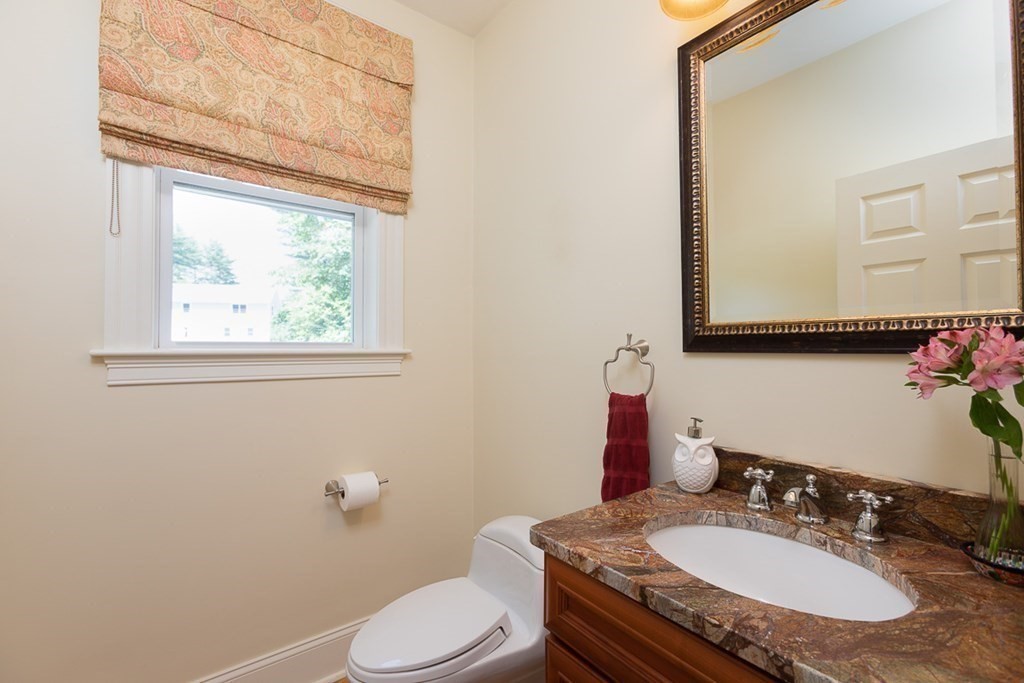 237 Newbury Road Rowley, MA 01969 - Photo 13 of 36 a bathroom with a granite countertop toilet sink and mirror
