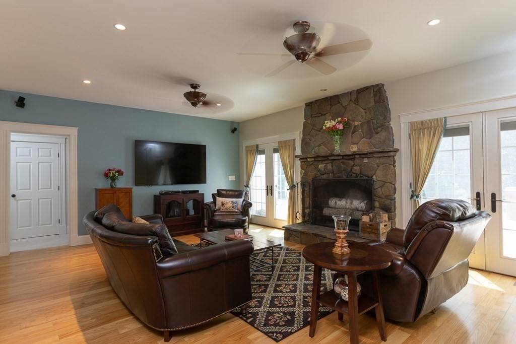 237 Newbury Road Rowley, MA 01969 - Photo 15 of 36 a living room with furniture and a flat screen tv