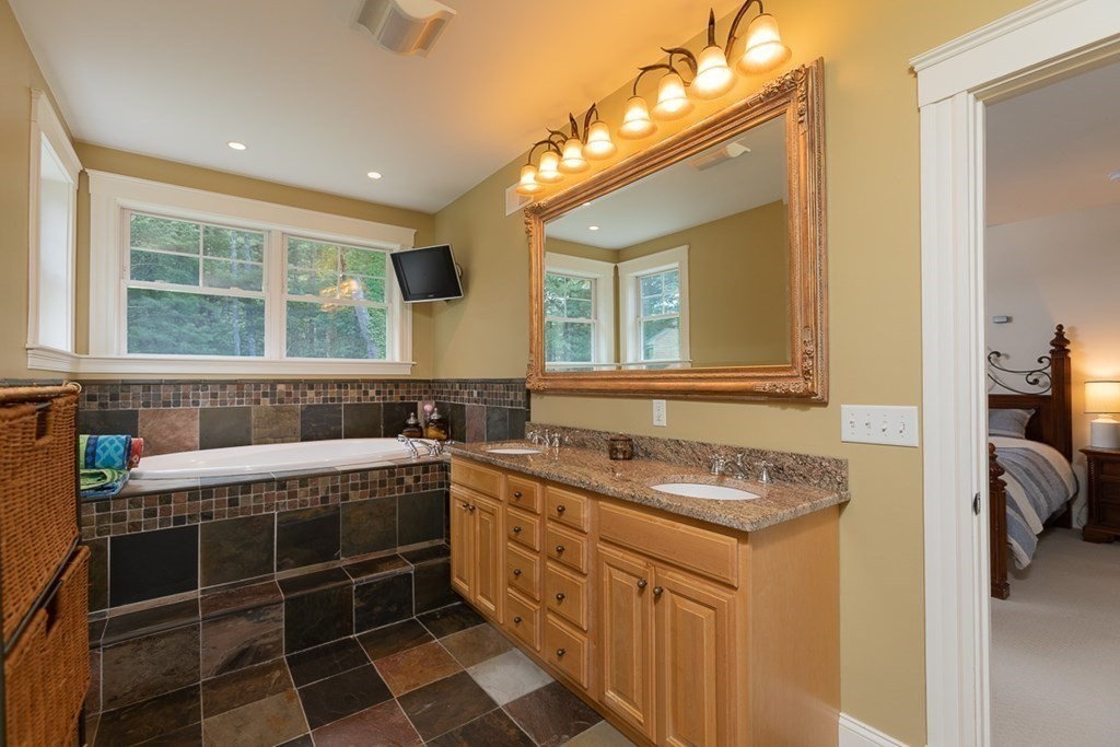 237 Newbury Road Rowley, MA 01969 - Photo 19 of 36 a bathroom with a granite countertop sink a mirror and a shower