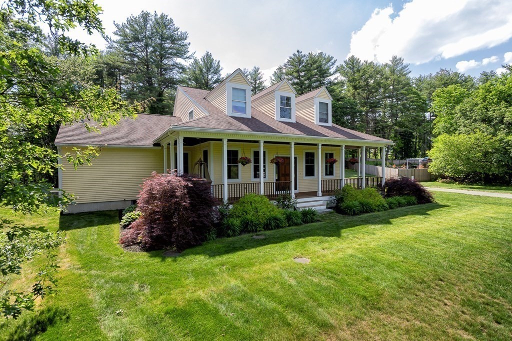 237 Newbury Road Rowley, MA 01969 - Photo 2 of 36 a front view of a house with a garden