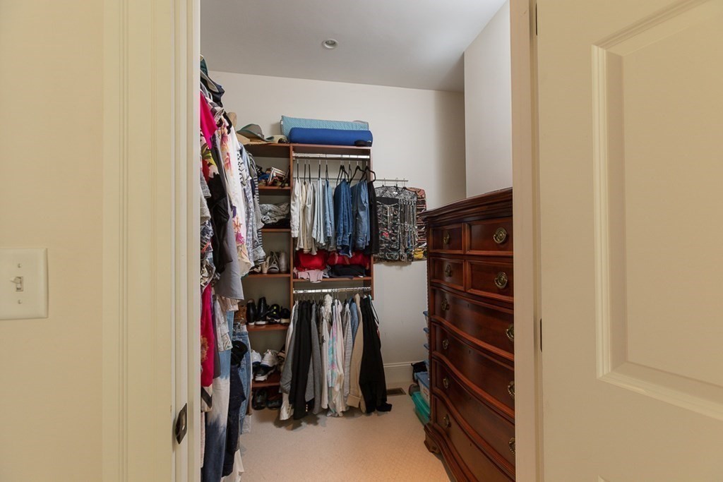 237 Newbury Road Rowley, MA 01969 - Photo 21 of 36 a view of walk in closet with clothes