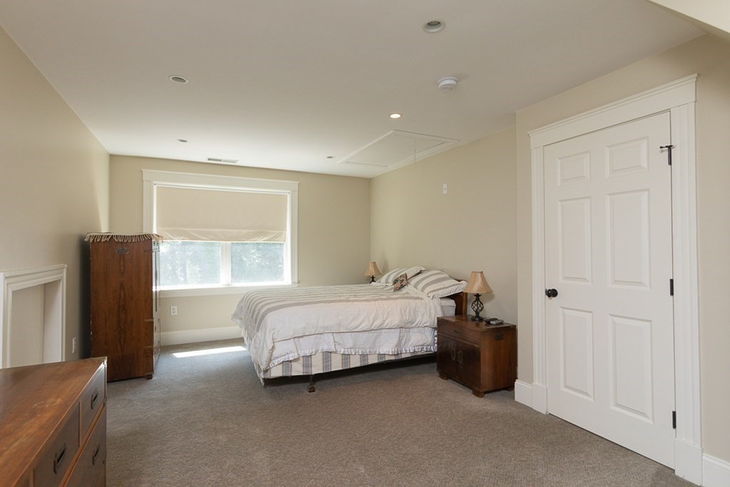 237 Newbury Road Rowley, MA 01969 - Photo 24 of 36 a bed room with a bed and a window