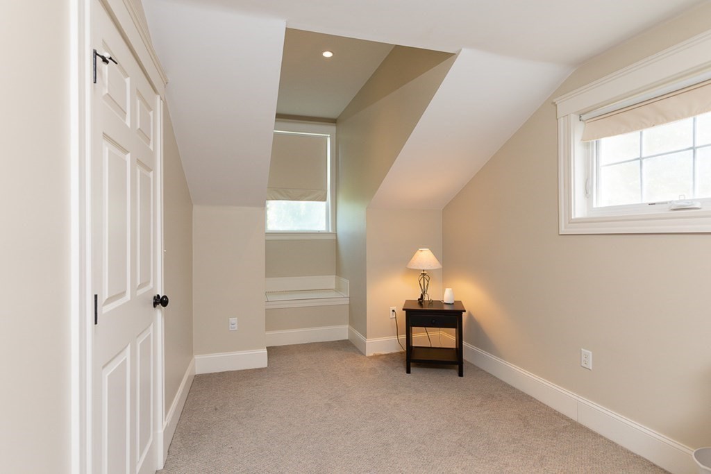 237 Newbury Road Rowley, MA 01969 - Photo 25 of 36 a bedroom with a bed and a window