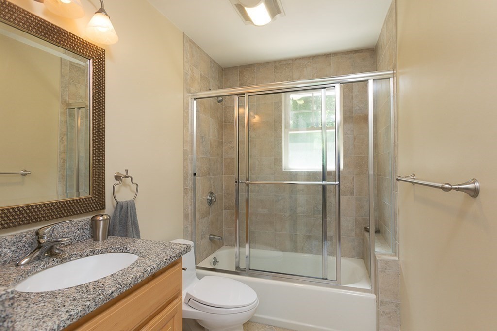 237 Newbury Road Rowley, MA 01969 - Photo 26 of 36 a bathroom with a granite countertop sink toilet and shower