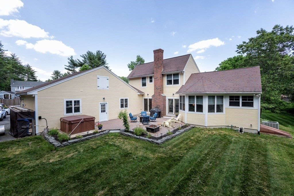 237 Newbury Road Rowley, MA 01969 - Photo 28 of 36 a front view of house with backyard and seating area