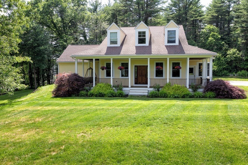 237 Newbury Road Rowley, MA 01969 - Photo 36 of 36 a view of a house with a yard and potted plants