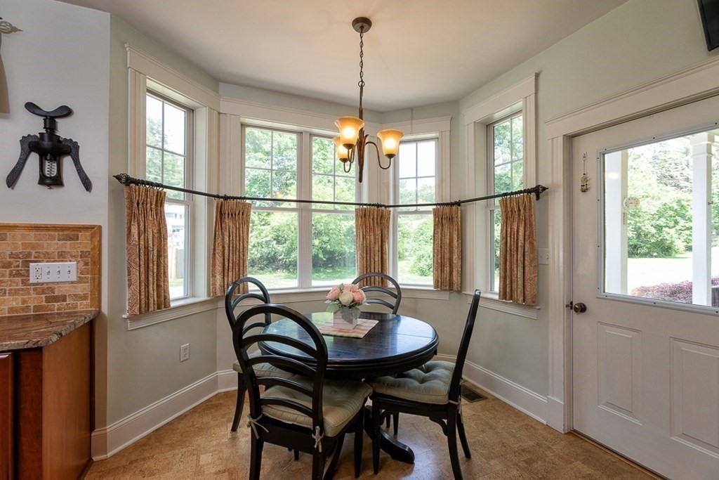 237 Newbury Road Rowley, MA 01969 - Photo 9 of 36 a view of a dining room with furniture window and outside view
